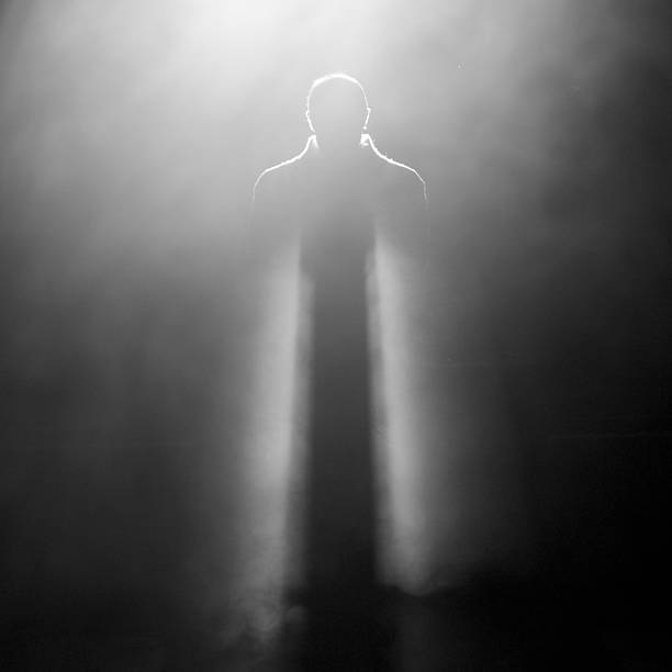 Photo of man standing on stage stock photo