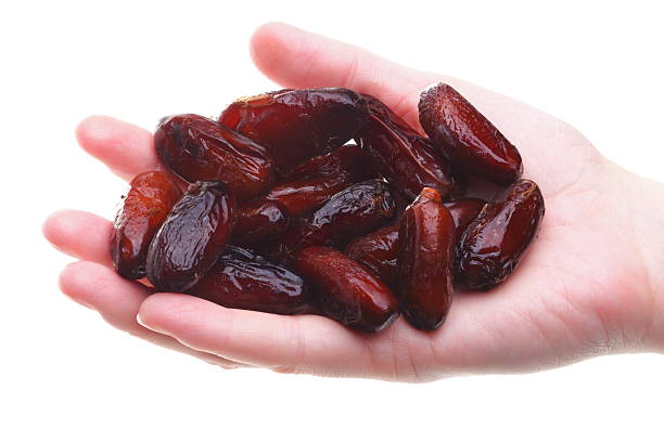 istock Dried date fruits in palm isolated 159012783