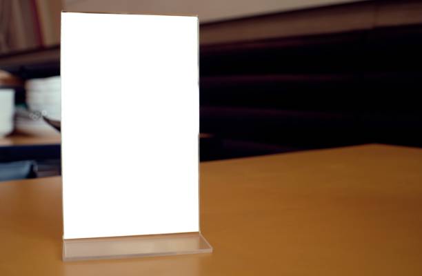 istock Menu frame standing on wood table in Bar restaurant cafe. space for text marketing promotion. 1590137959