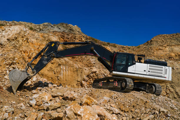 Hydraulic crawler excavator in stone quarry at work