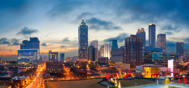Panoramic image of the Atlanta skyline during sunrise. This is composite of two horizontal images stitched together in photoshop. 