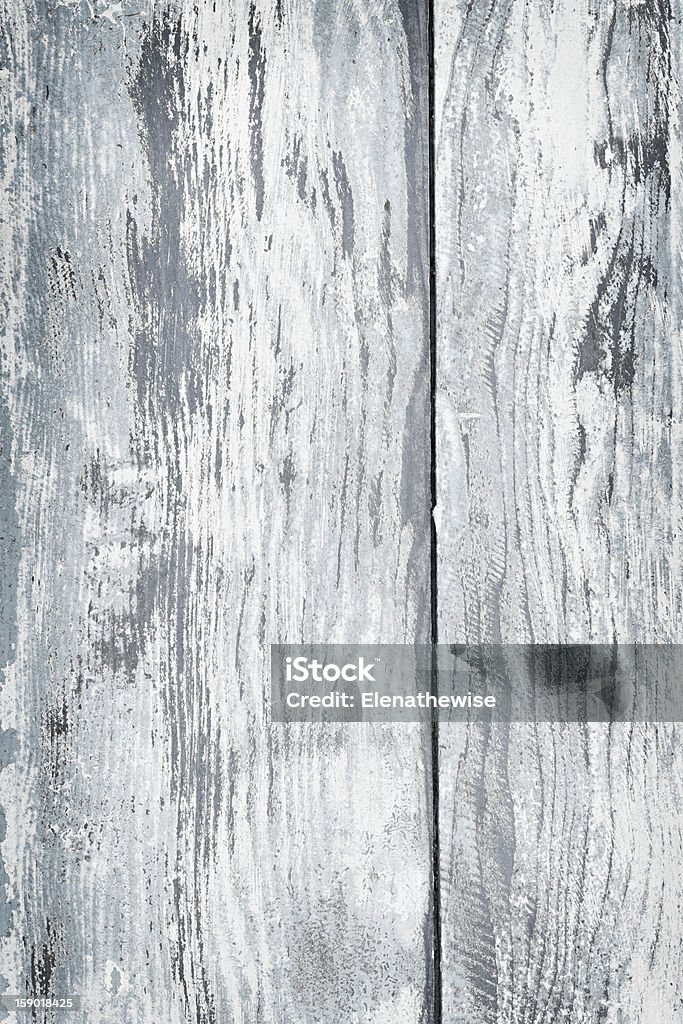 Old painted wood background Textured background of distressed rustic wood with peeling blue and white paint Backgrounds Stock Photo