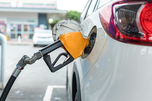 Refill and filling Oil Gas Fuel at station. Gas station - refueling. To fill the machine with fuel. Car fill with gasoline at a gas station. Gas station pump.