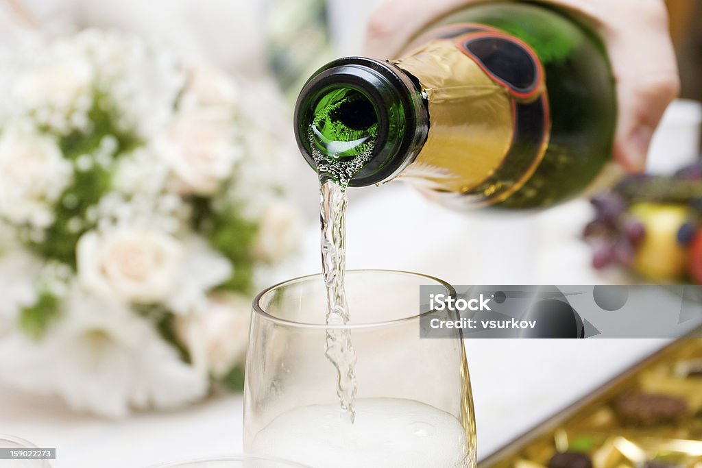 pouring champagne pouring champagne to the glass Alcohol - Drink Stock Photo