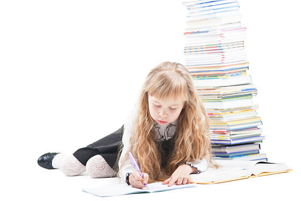istock Beautiful schoolgirl write in copybook 159022393