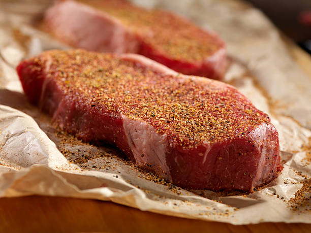 istock Raw Steaks Seasoned in Butcher Paper 159024832