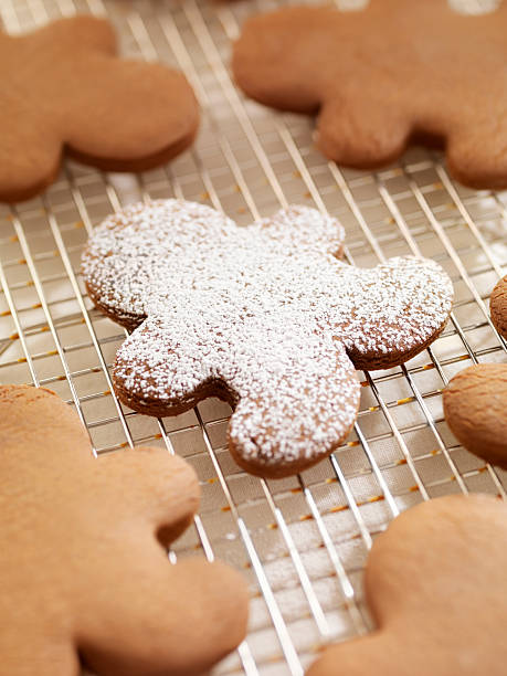 istock Gingerbread Men Cookies Sprinkled with Icing Sugar 159024875