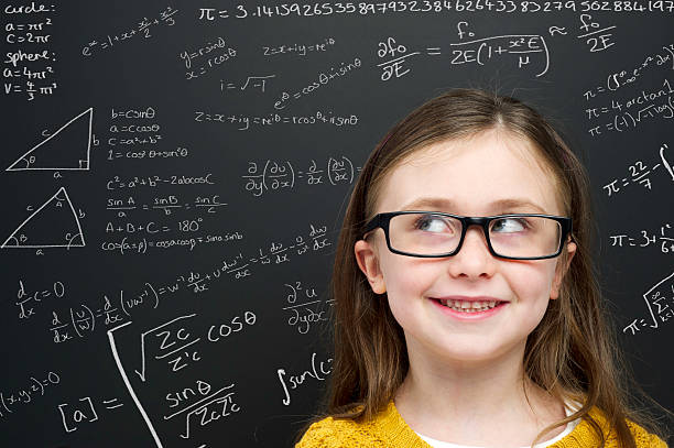 istock Smart young girl stood infront of a blackboard 159025326