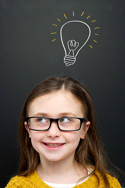 istock Smart young girl stood infront of a blackboard 159025367