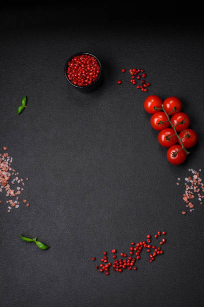 istock Ingredients for cooking cherry tomatoes, salt, spices and herbs 1590287388