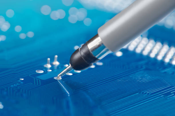 istock Measuring electronic signal using oscilloscope on the PCB. Electronics repair and digital technology. 1590287738