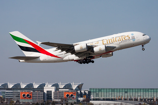 Munich, Germany - March 30, 2014: Emirates passenger plane at airport. Schedule flight travel. Aviation and aircraft. Air transport. Global international transportation. Fly and flying.
