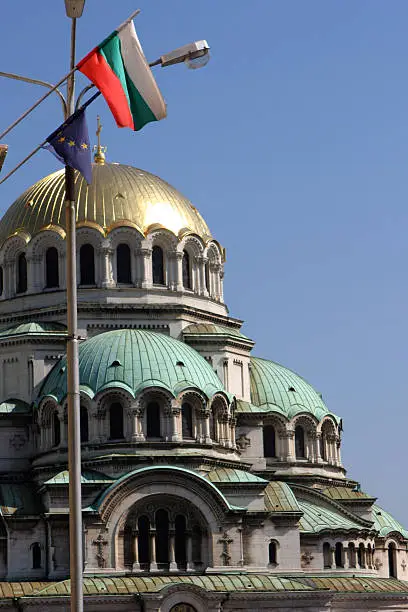 Domes of the Alexander Nevski church in Sofia,Bulgaria,wih bulgarian and European flags