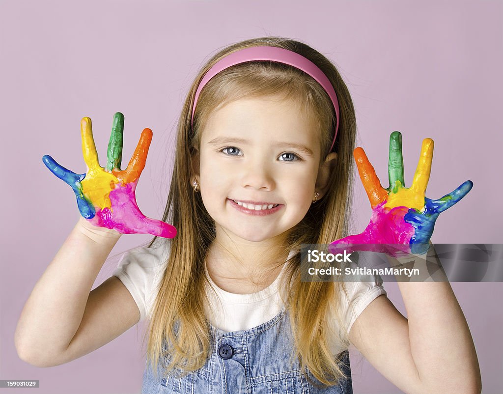 Smiling little girl with hands in the paint Beautiful smiling little girl with hands in the paint Baby - Human Age Stock Photo