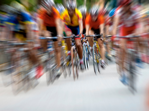 Photo of a cycling competition. Blurred Motion.