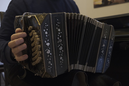 Accordion Instrument Being Played by a Man