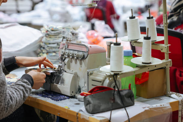 istock Tailor and worker in clothes factory 1590332307