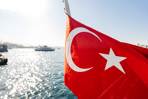 Turkish flag waving on a tour boat in Istanbul, Turkey.