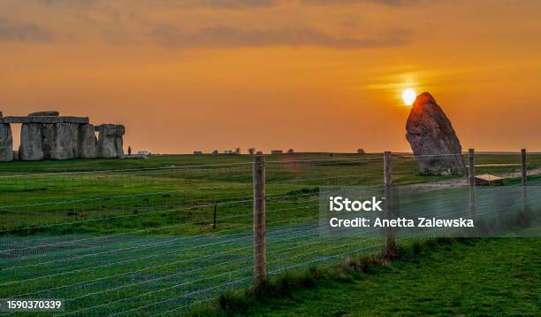Popular Grassland In Wiltshiresunset Over Stonehenge Stock Photo - Download Image Now