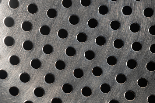 metal grid with round holes in a closeup