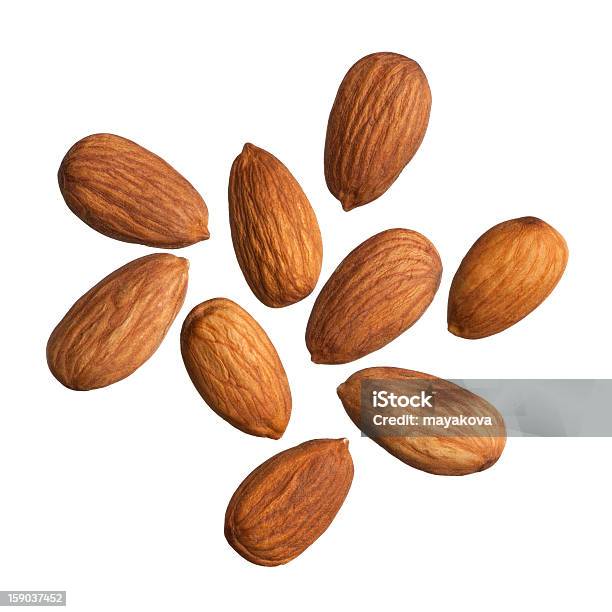 Nine Scattered Almonds On A White Background Stock Photo - Download Image Now - Almond, White Background, Cut Out