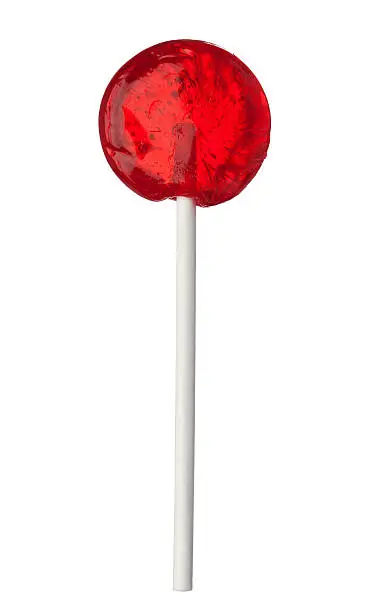 One red lollipop isolated on white background, close-up. This image is isolated with light during the photo shoot process.