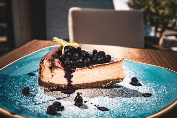 istock Blueberry cheesecake on the blue plate in the restaurant 1590377082