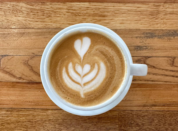 istock A cup of coffee latte on a wooden table 1590388696