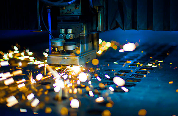 Laser cutting close up Laser cutting with sparks close up machinery stock pictures, royalty-free photos & images
