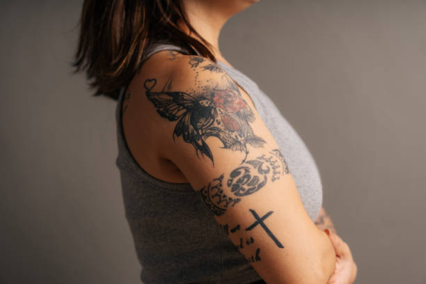istock Woman's arm with tattoos 1590407925