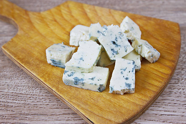 istock cheese with blue mold, a wooden board 159040802