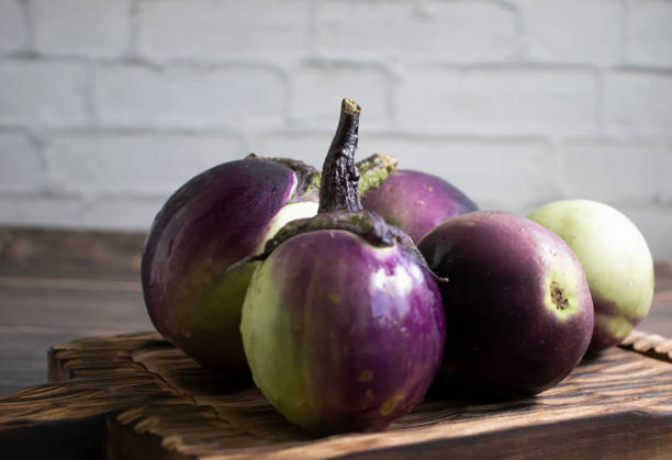 istock Eggplant on old wooden background 1590413233