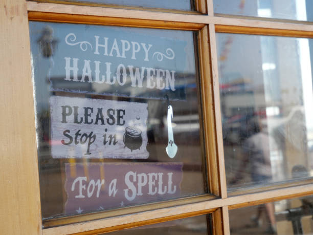 istock Decorative wooden Halloween signs in a window 1590433355