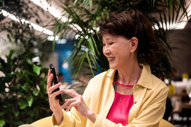 istock Senior businesswoman using cell phone 1590464225