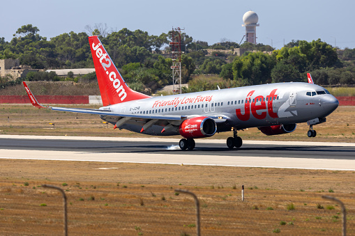 Luqa, Malta - August 3, 2023: Jet2 Boeing 737-8K5 (Reg.: G-JZHB) touching down on a hot morning.