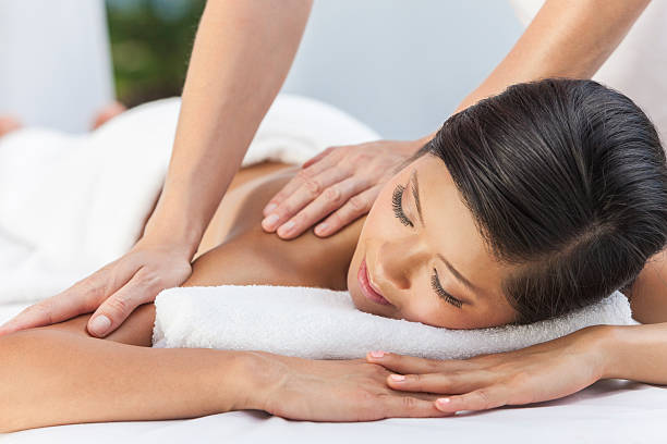 istock Woman Relaxing At Health Spa Having Massage 159049955