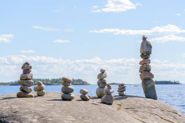 istock Pyramid of stones. Unstable balance of stone objects. 1590502613