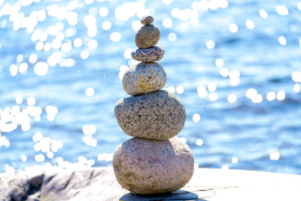 istock Pyramid of stones. Unstable balance of stone objects. 1590504774
