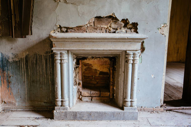 Old fireplace in abandoned mansion.