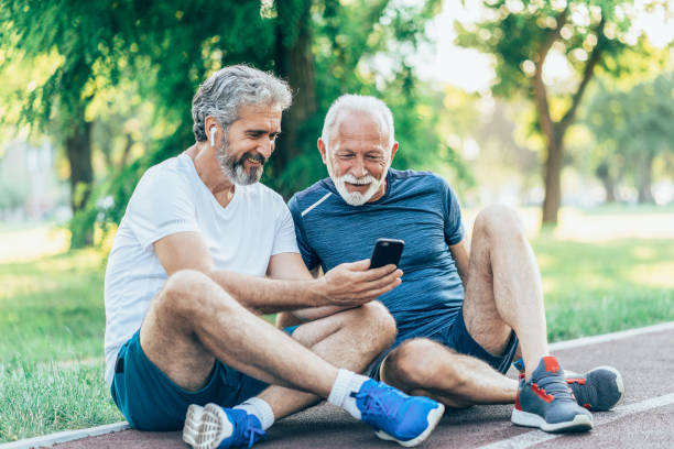 istock Senior friends resting after jogging 1590522316