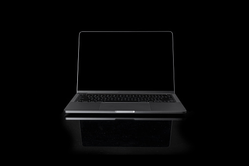 Photo of realistic modern laptop with blank screen on a black background