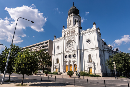 An Orthodox Church against a Blue Sky in an Urban Area