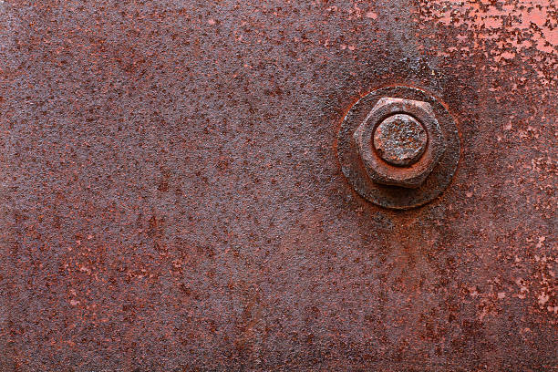 Rusty bolt and metal plate stock photo