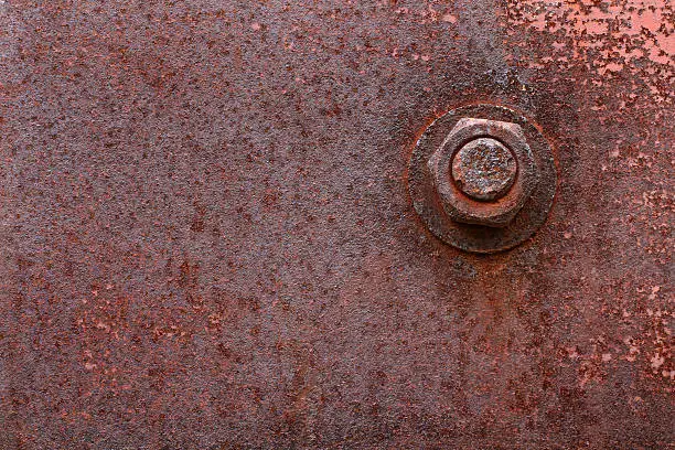 Photo of Rusty bolt and metal plate