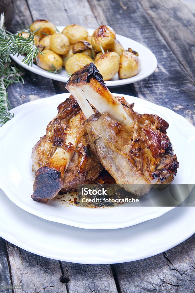 baked meat, pork knuckle Mediterranean diet, main dish meat baked pork shank. Cooked Stock Photo