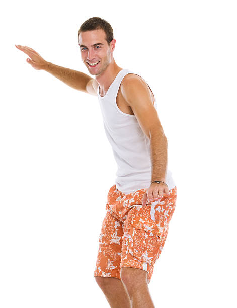 istock On vacation smiling young man surfing isolated 159055997