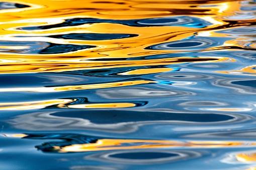 Water Surface Reflecting Yellow Boat