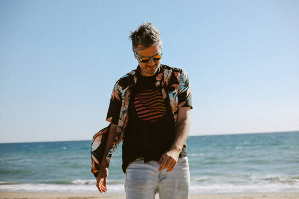 istock Man walking at the Malibu beach 1590584859