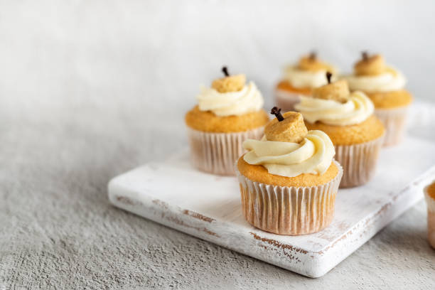 istock Group of  cupcakes with Thanksgiving cake decoration 1590588540