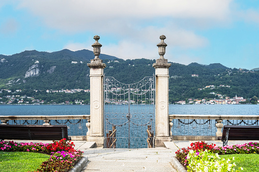 A garden with gate, on Lake Orta, Italy, great lakes region.